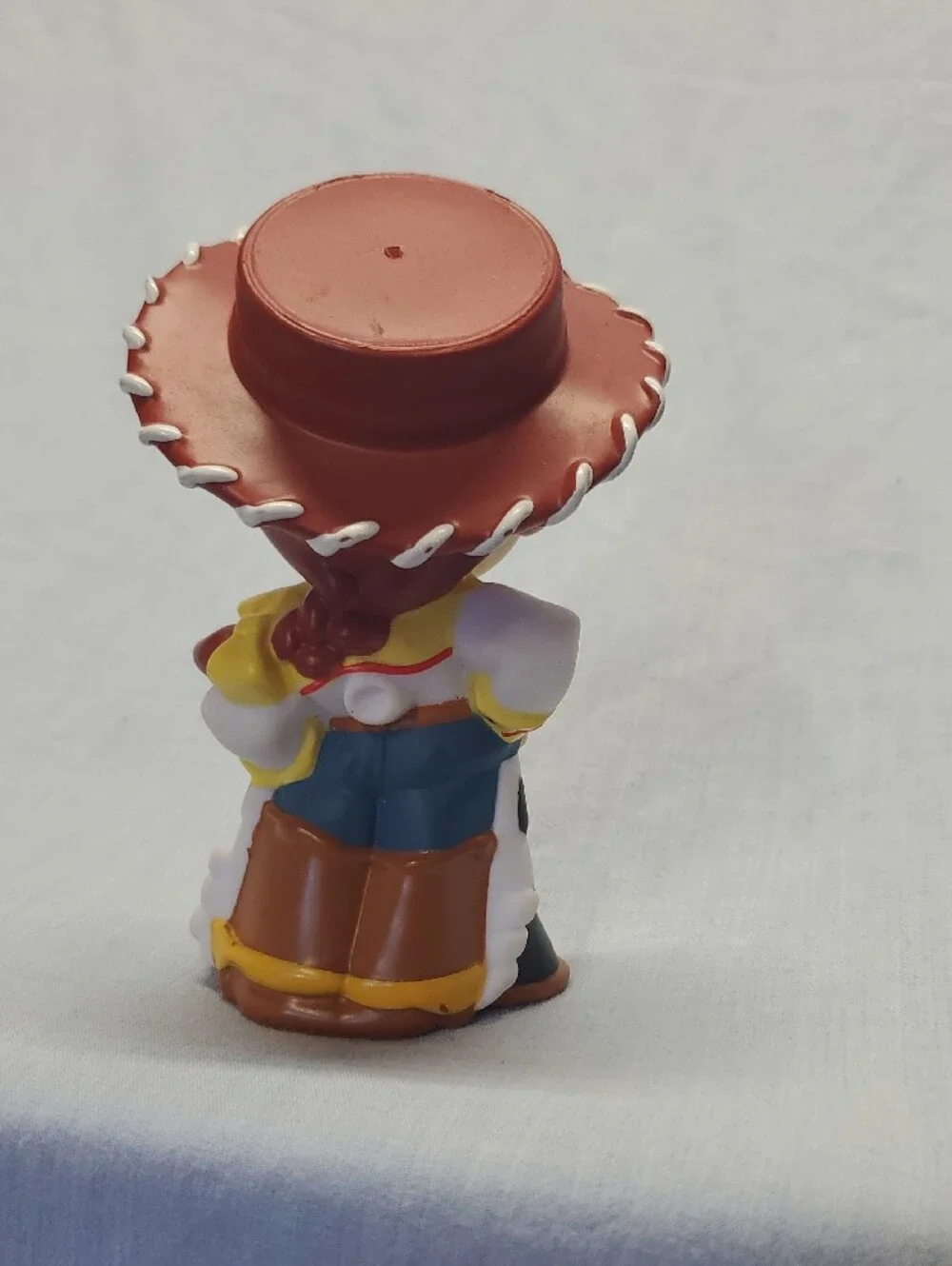 Disney Cowgirl Figure with Red Hat and Green Eyes